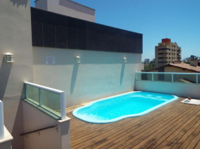 Casa 3 dormitórios sendo uma suíte com ar - condomínio de 6 casas - piscina do condomínio